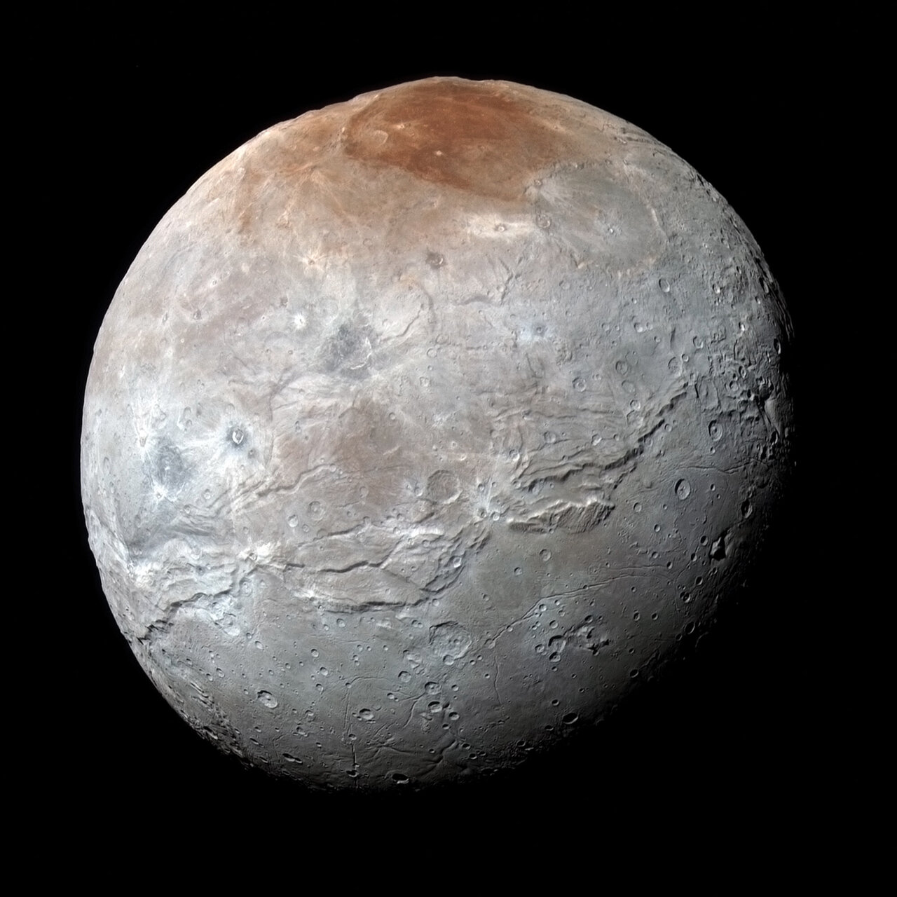 La luna de Plutón con polo norte rojo era un misterio.